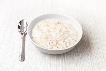 oatmeal in milk - light background