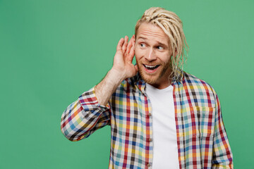 Young curious nosy caucasian blond man with dreadlocks 20s he wear casual shirt try to hear you...