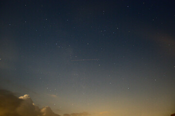 Naklejka premium Plane In The Night Sky.