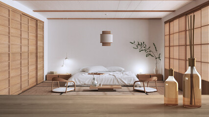 Wooden table top or shelf with aromatic sticks bottles over modern japandi bedroom with double bed,...