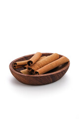 cinnamon sticks on a wooden spoon