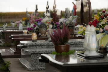 Decorations on graves in a cemetery.