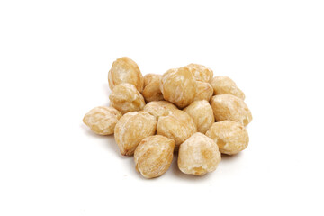 Indonesia Candlenut on wooden with isolated white background