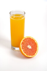 glass of orange juice and orange