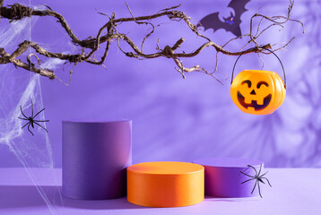 Halloween party concept. Podiums or pedestals for products display and pumpkin buckets for candies...