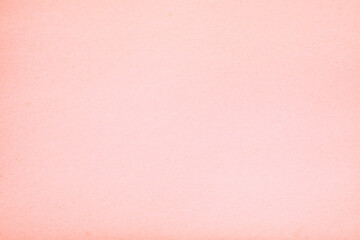 Old vintage pink paper surface texture close up
