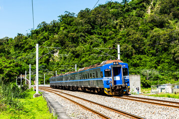 Naklejka premium The train through the beautiful countryside of Taitung, Taiwan.