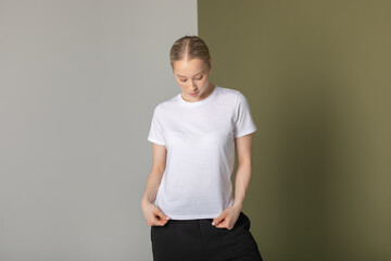 Attractive blonde woman in white t-shirt. Mock-up.