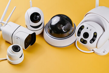 Surveillance cameras, set of different videcam, cctv cameras isolated on yellow background close...