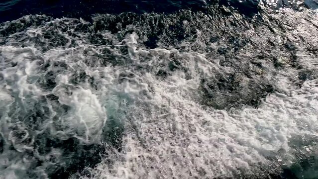 Majestic slow motion views of the wake and waves as a boat glides through Lake Superior. Located between Copper Harbor and Isle Royale in the Upper Peninsula of Michigan.