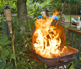 Flames from backyard BBQ Grill. 