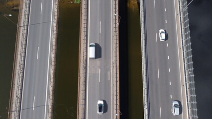 Three line bridge above Nerius river, Kaunas, Lithuania, Central Europe. Cars, trucks, differnt angel of view on same bridge