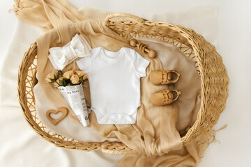 Mockup of baby bodysuit shirt . Baby Announcement. Pregnancy announcement background with blurred ....