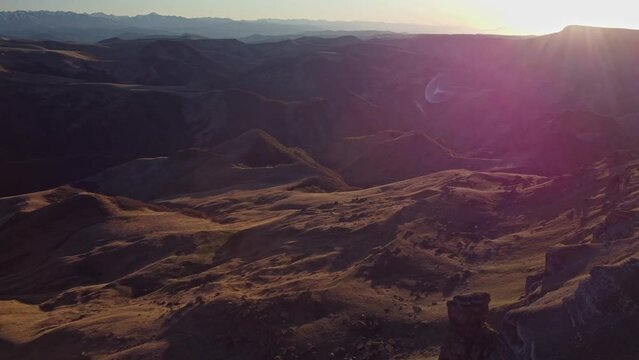 sunset flight over the Bermamyt plateau, Caucasus. bird's-eye view of the mountains in the evening light