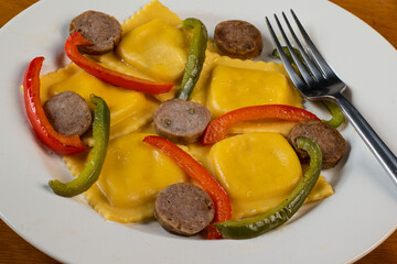 four cheese ravioli  with sweet italain sausage  and peppers