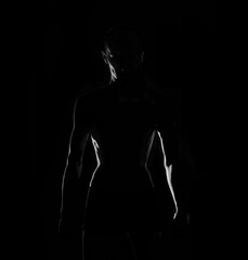 silhouette of  a male body topples 