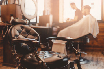 Modern hairdresser and hair salon, barber shop for men. Barbershop armchair vintage color background