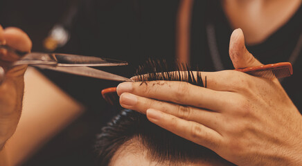 Banner Barbershop concept, vintage color. Portrait man in haircut salon, master working hair styling