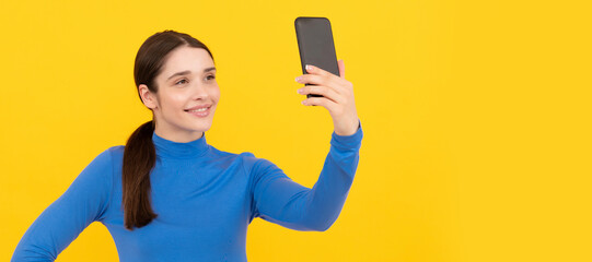 Woman isolated face portrait, banner with copy space. vlog with mobile phone. businesswoman making selfie. agile business blogging.