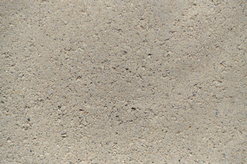 Abstract background, gray concrete pavement texture closeup.