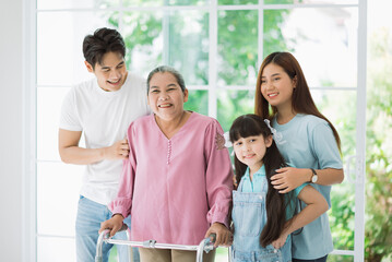 Happy asian family spending time together on vacation at new home, grandmother with family members.