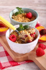 Peach and raspberry crumble cake