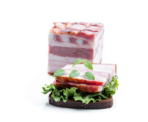 Homemade sandwich with rye bread and smoked bacon isolated on white