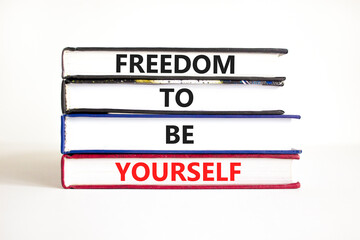 Freedom to be yourself symbol. Concept words Freedom to be yourself on books on a beautiful white table white background. Business, psychological freedom to be yourself concept.