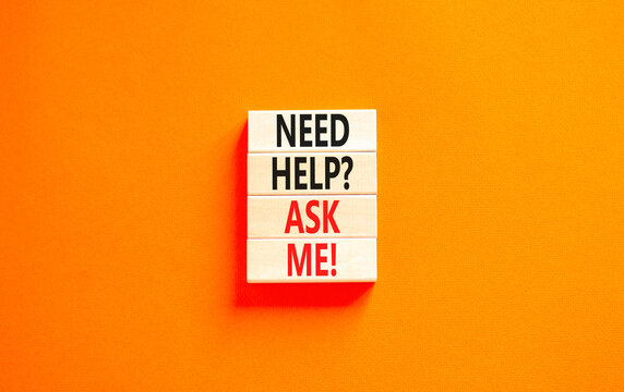Support and need help ask me symbol. Concept words Need help ask me on wooden blocks on a beautiful orange table orange background. Business, support and Need help ask me concept.
