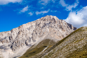 Panoramic view from Gran Sasso mountain, in Abruzzo region, central Italy, summer day in the mountains. Tourist destination in Italy. Drone view