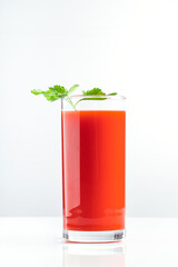 Diet tomato juice with parsley on white background. Vegan vegetable smoothie.