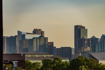 sunset over new york city skyscrapers and skyline facade of an building