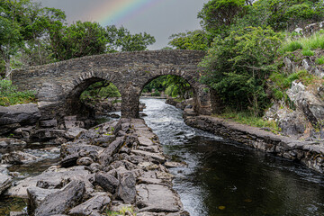 Fototapeta na wymiar Meeting of the Waters, Killarney. the best hidden gem. This is the point where all of Killarney’s three glorious lakes merge together, the upper lake, Muckross Lake and Lough Leane. Old Weir Bridge.
