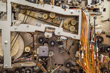 background of the drive gear and mechanisms of the metal dispenser ATM