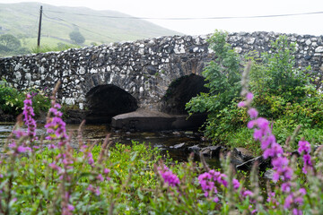 Fototapeta na wymiar The Quiet Man Bridge is a dry stone bridge located between Galway and Clifden in Ireland.