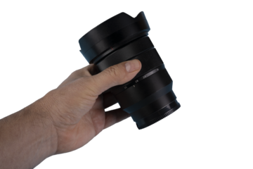 a lens for the camera in a male hand on a transparent background