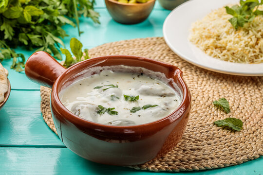 Kebbeh Bil Laban with biryani served in a dish isolated on wooden table side view of middle eastern food