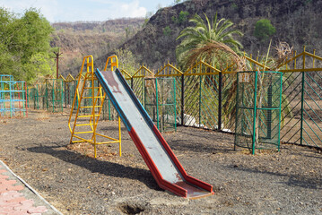 Children's playground slide at mountain village Kalakund near Mhow, Indore, Madhya Pradesh on a...
