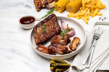 Grilled pork ribs with barbecue sauce  and grilled vegetables. top view 