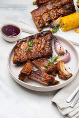 Grilled pork ribs with barbecue sauce  and grilled vegetables. top view 