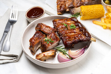 Grilled pork ribs with barbecue sauce  and grilled vegetables. top view 