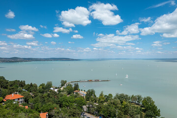 View of Balaton lake on a sunny day with blue sky and clouds, view from Tihany village, Hungary
