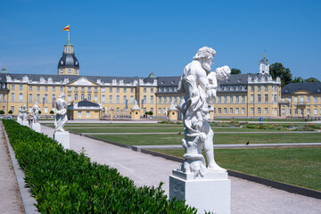 White sculpture on the background of the Karlsruhe Palace and other sculptures, Karlsruhe, Baden-Wuerttemberg, Germany
