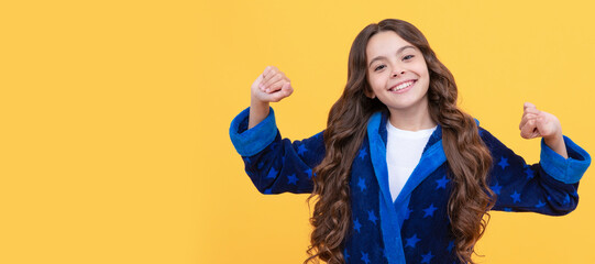in good mood. sleepy kid stretching sleepily. smiling child wearing comfortable pajama. Child face,...
