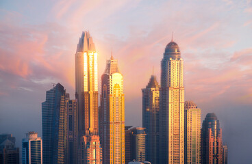 Dubai Marina skyscrapers view at golden sunset. Dubai, UAE.
