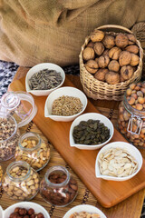 Assortment of nuts on rustic wood table
