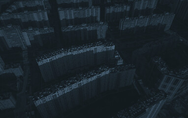 De-energized residential buildings of the metropolis. Dark streets of a de-energized metropolis. Only moonlight. Drone view
