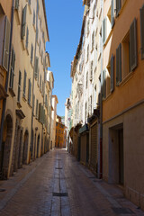 Fototapeta na wymiar Old Narrow street and apartment buildings in Toulon, Riviera, Cote d'Azur.