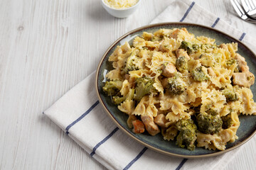 Homemade One-Pot Creamy Chicken and Broccoli Pasta on a Plate, side view. Space for text.