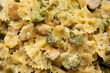 Homemade One-Pot Creamy Chicken and Broccoli Pasta on a Plate, top view. Flat lay, overhead, from above. Close-up.